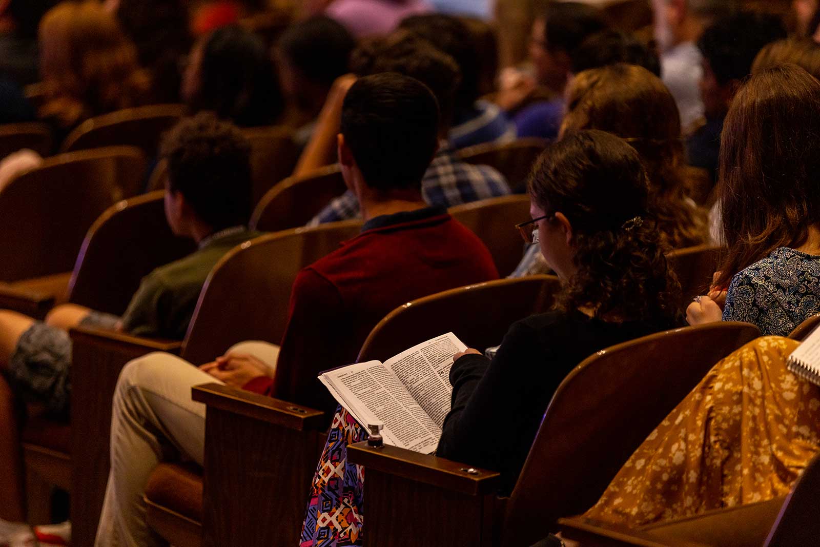 girl in church with bible