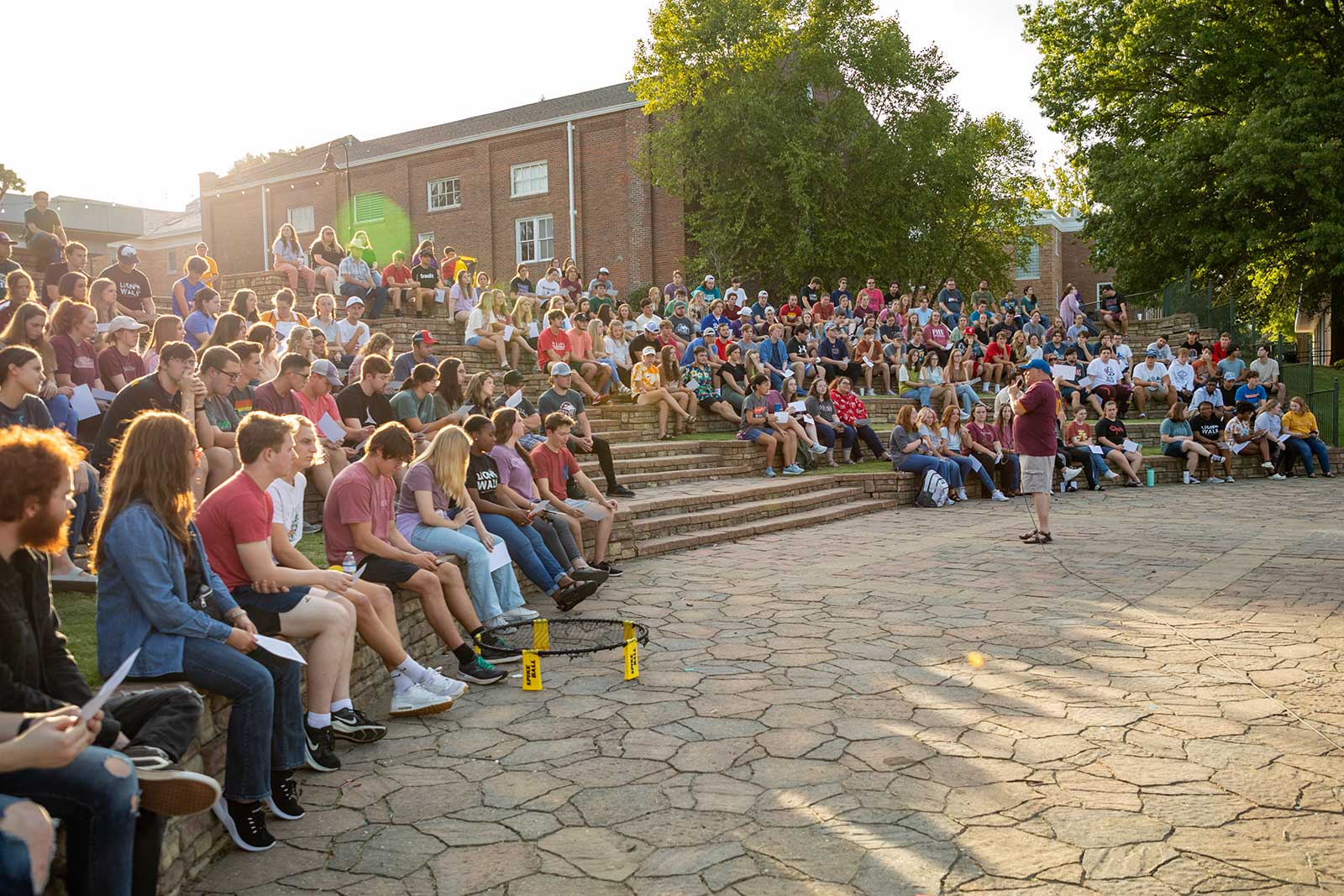 students outside gathering in outdoor class