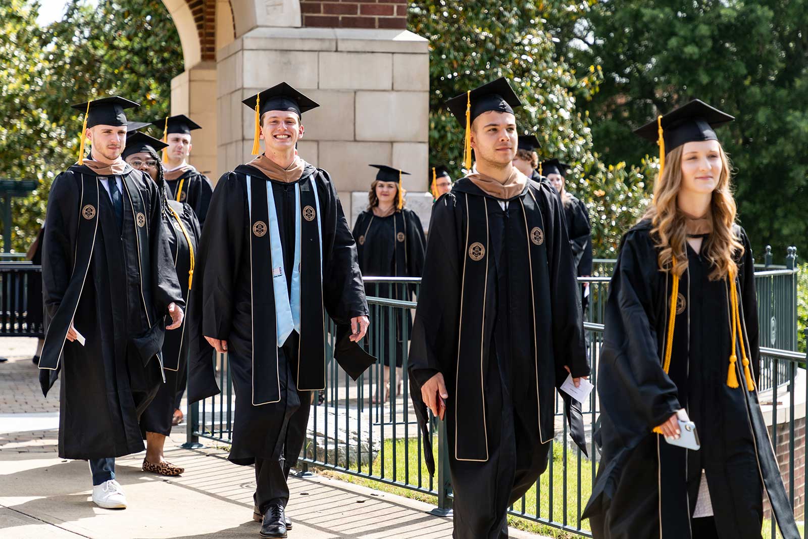 students walking into commencement